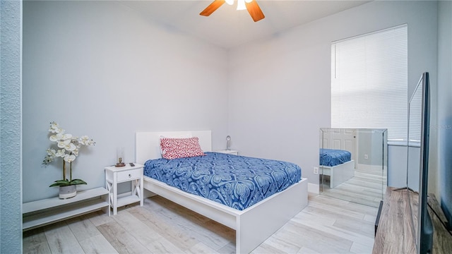 bedroom featuring ceiling fan and light wood-style flooring