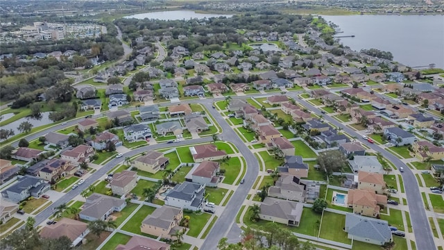 bird's eye view with a water view and a residential view