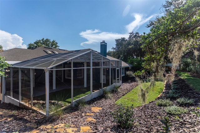 view of swimming pool with glass enclosure