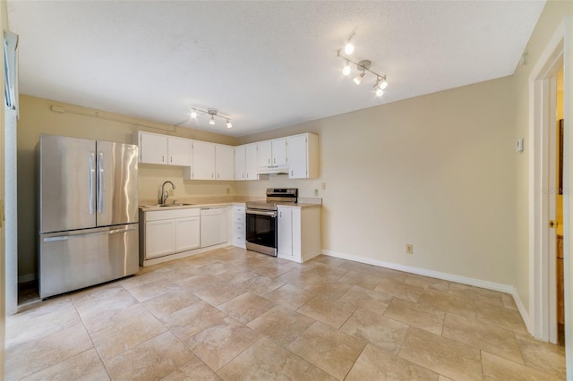 kitchen featuring stainless steel appliances, light countertops, under cabinet range hood, white cabinetry, and a sink