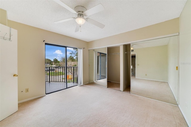 unfurnished bedroom with a textured ceiling, ceiling fan, light colored carpet, and access to exterior