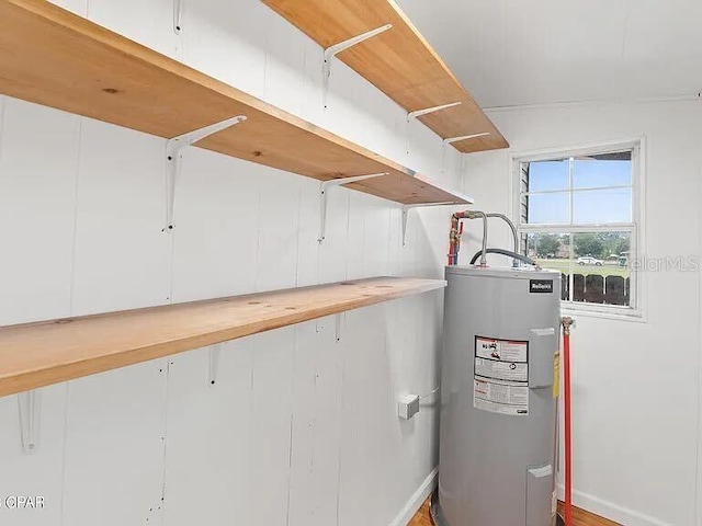 utility room featuring water heater