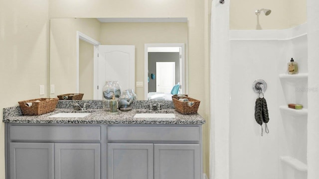 bathroom with double vanity and a sink