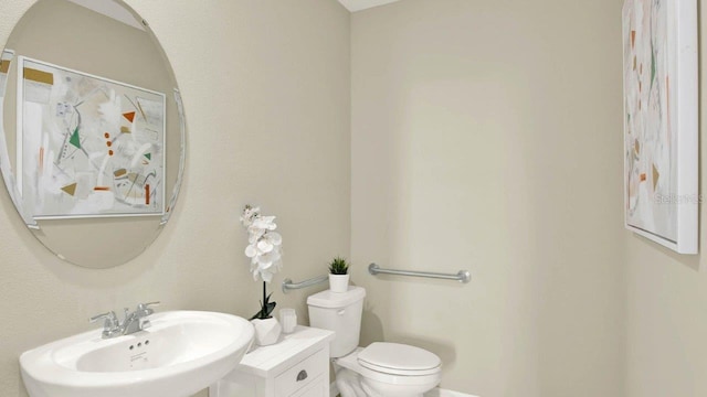 bathroom with a sink and toilet