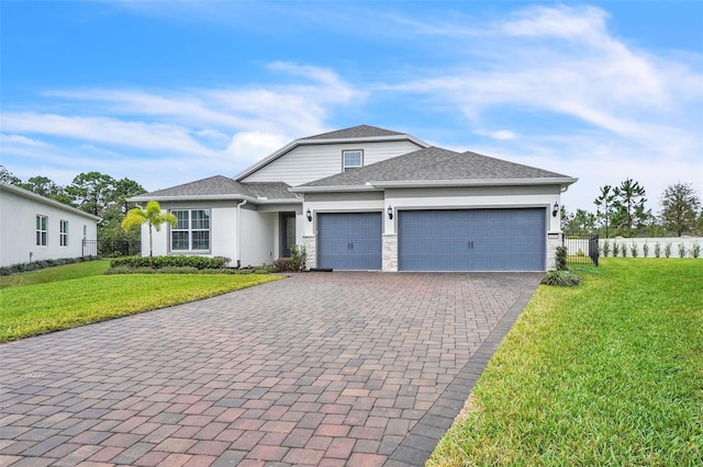 view of front of house with a garage, fence, stone siding, decorative driveway, and a front lawn