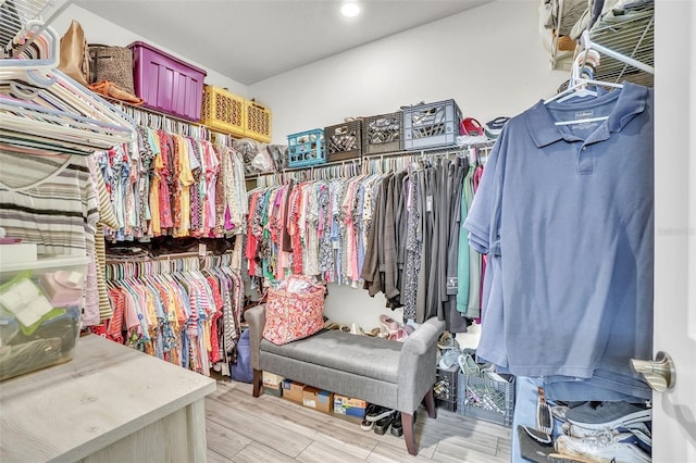 spacious closet featuring light wood-style floors