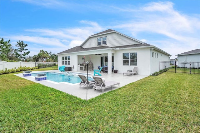 back of house featuring a fenced in pool, a patio, a ceiling fan, a fenced backyard, and a yard