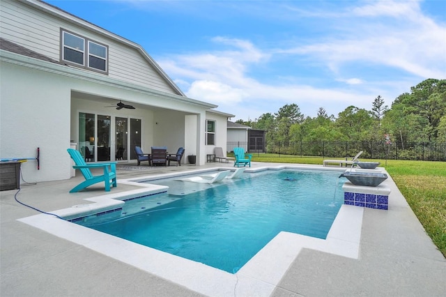 view of pool with ceiling fan, a patio area, fence, and a fenced in pool