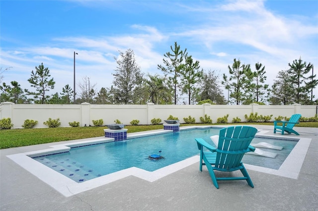 view of pool with a fenced in pool, a fenced backyard, and a patio