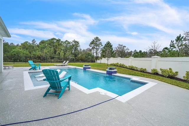 view of swimming pool featuring a fenced in pool, a fenced backyard, a patio, and a lawn