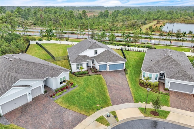 bird's eye view featuring a water view and a forest view