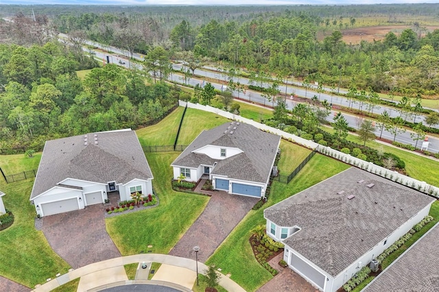 aerial view featuring a wooded view