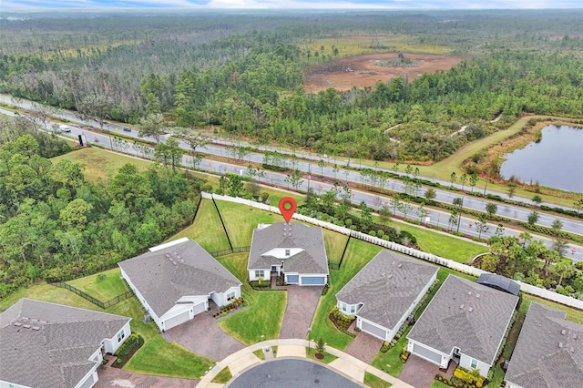 bird's eye view featuring a water view and a forest view