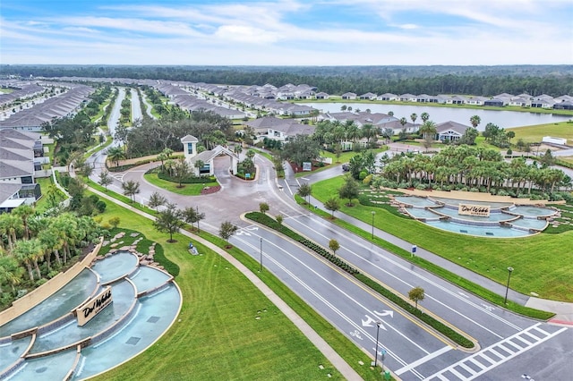 birds eye view of property with a water view and a residential view