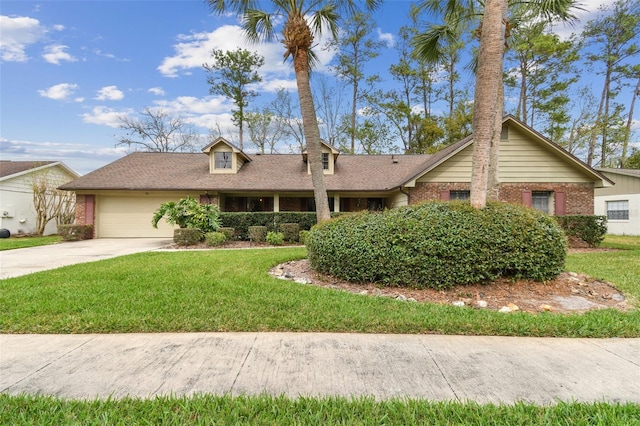 view of front of house featuring driveway, an attached garage, a front yard, and brick siding