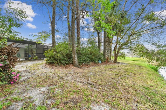 view of yard featuring a lanai