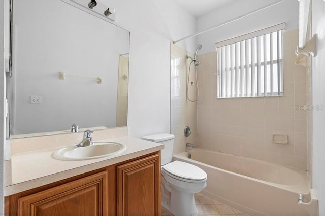 bathroom featuring washtub / shower combination, vanity, and toilet