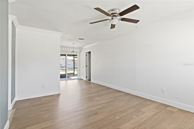 spare room with baseboards, crown molding, light wood finished floors, and ceiling fan with notable chandelier