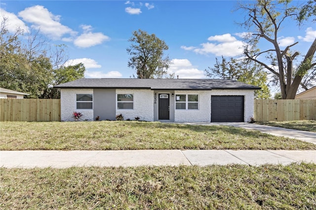 single story home featuring driveway, an attached garage, fence, and a front yard