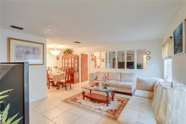 living room with visible vents and light tile patterned floors