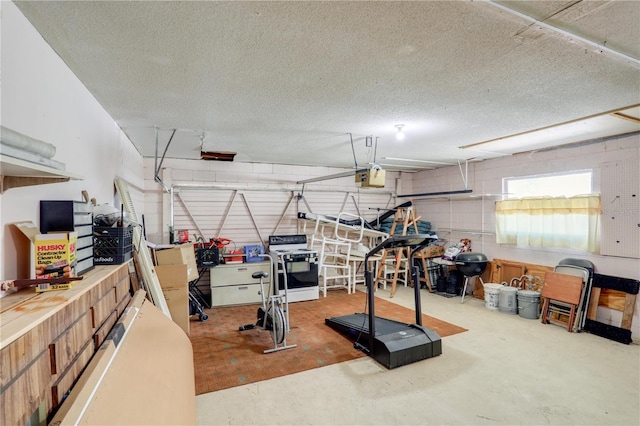 exercise room with a garage and a textured ceiling