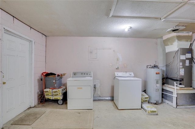 clothes washing area with heating unit, laundry area, water heater, and separate washer and dryer