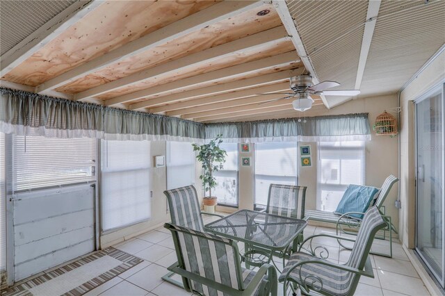 sunroom / solarium featuring ceiling fan