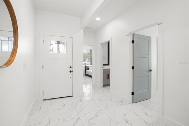 entryway with recessed lighting, marble finish floor, visible vents, and baseboards