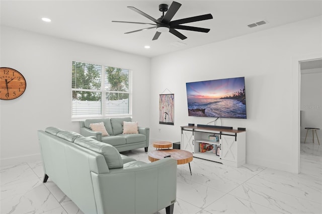 living area with marble finish floor, visible vents, and recessed lighting