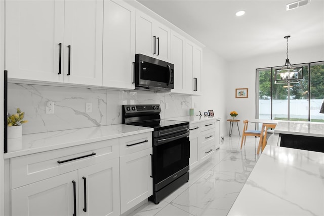 kitchen featuring white cabinets, decorative backsplash, electric range oven, stainless steel microwave, and marble finish floor