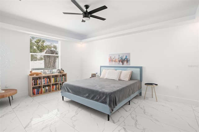 bedroom with marble finish floor, ceiling fan, and baseboards