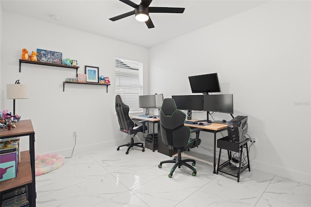 home office with ceiling fan, marble finish floor, and baseboards