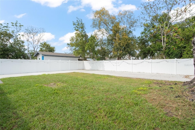 view of yard with a fenced backyard