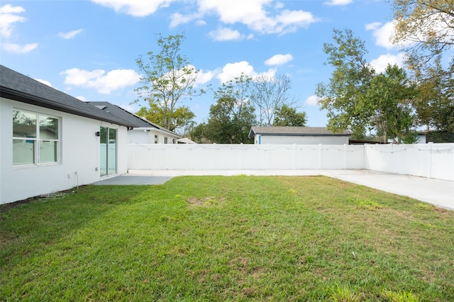 view of yard featuring a patio area and a fenced backyard