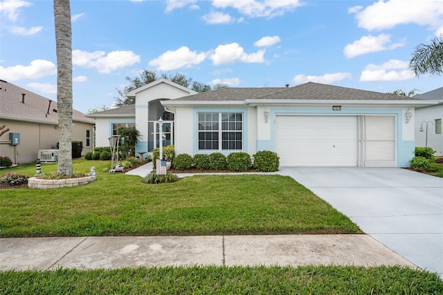 ranch-style home featuring a front yard, an attached garage, concrete driveway, and stucco siding