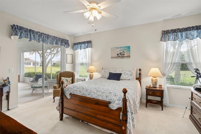 bedroom featuring light carpet, a ceiling fan, baseboards, and access to outside