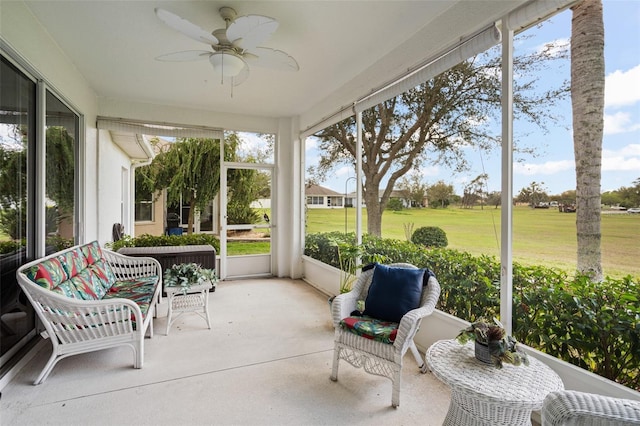 sunroom / solarium with ceiling fan