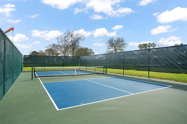 view of sport court with fence