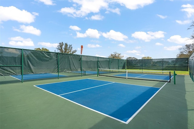 view of sport court with community basketball court and fence