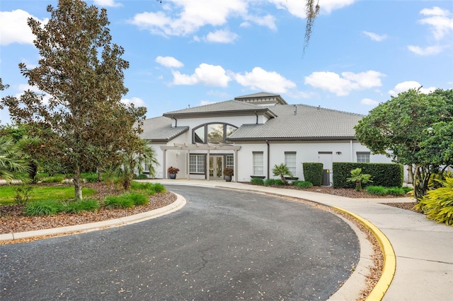 view of property with aphalt driveway