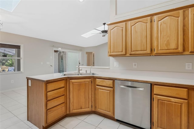 kitchen featuring light tile patterned floors, dishwasher, a peninsula, light countertops, and a sink