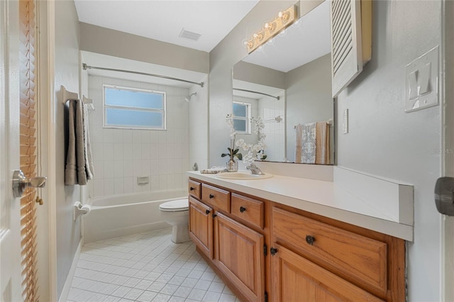 full bath with visible vents, toilet, tub / shower combination, vanity, and tile patterned floors