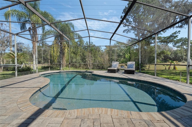 pool with a patio area and glass enclosure