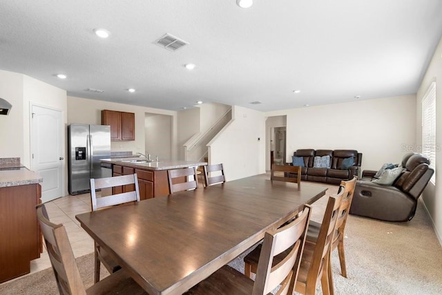 dining area with stairs, recessed lighting, visible vents, and light tile patterned floors