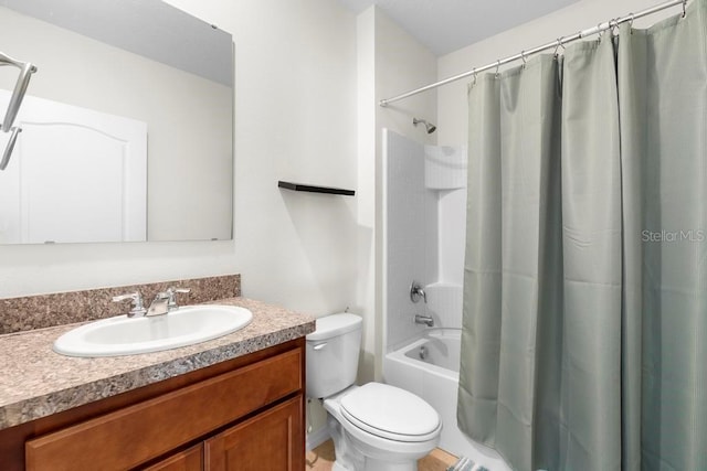 bathroom with shower / bath combo, vanity, and toilet