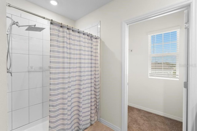 bathroom with baseboards, recessed lighting, and a shower with curtain