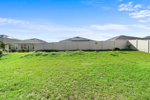 view of yard featuring a fenced backyard