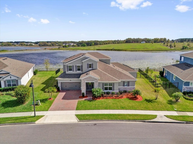 birds eye view of property featuring a water view