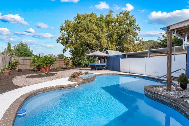 view of swimming pool featuring a patio, a fenced backyard, and a fenced in pool