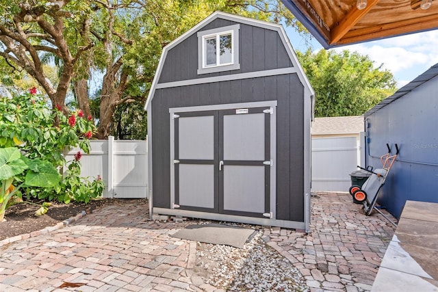 view of shed with a fenced backyard